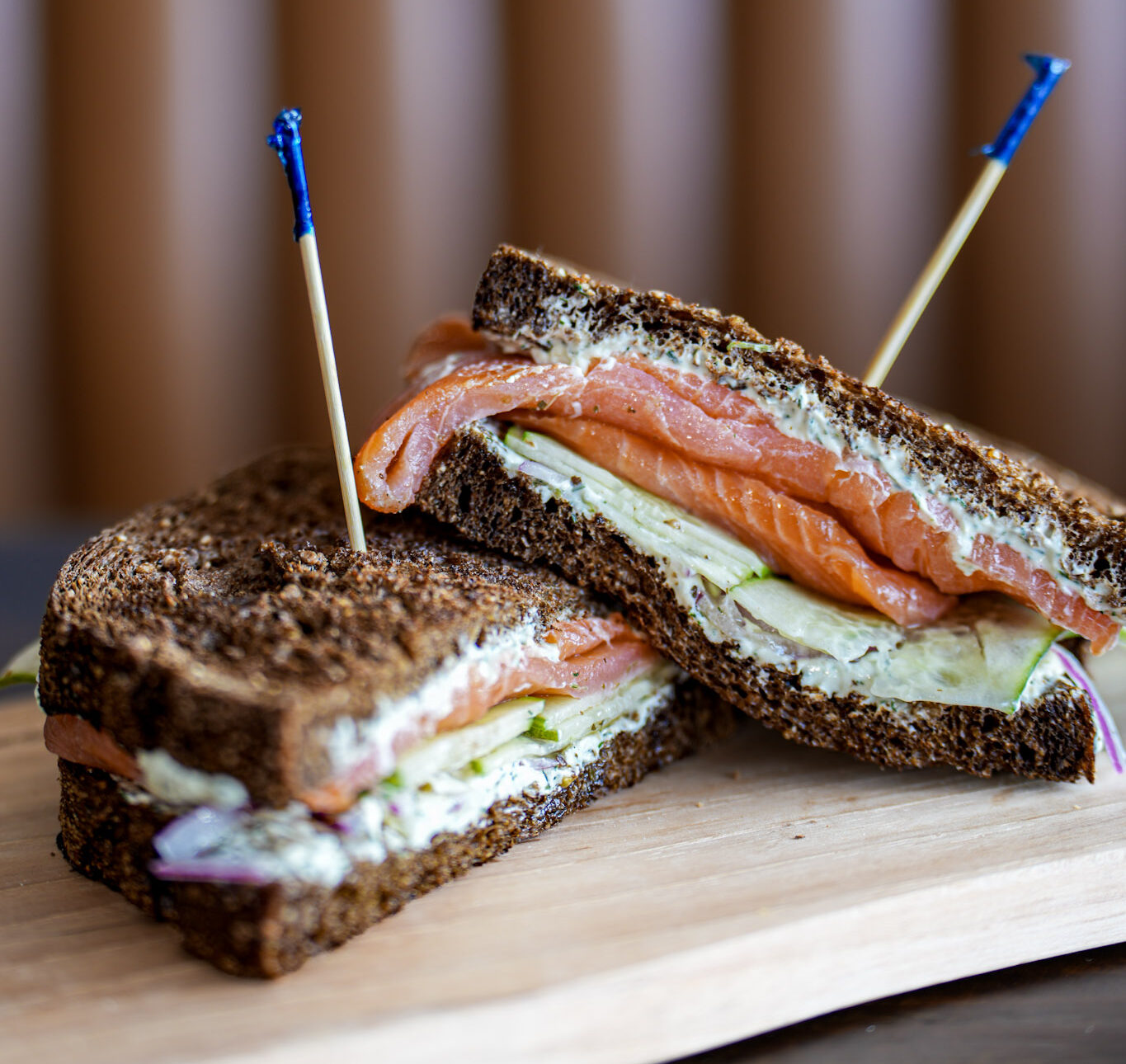 The Alaskan sandwich on toasted pumpernickel with smoked salmon, dill cream cheese, cucumber and red onion