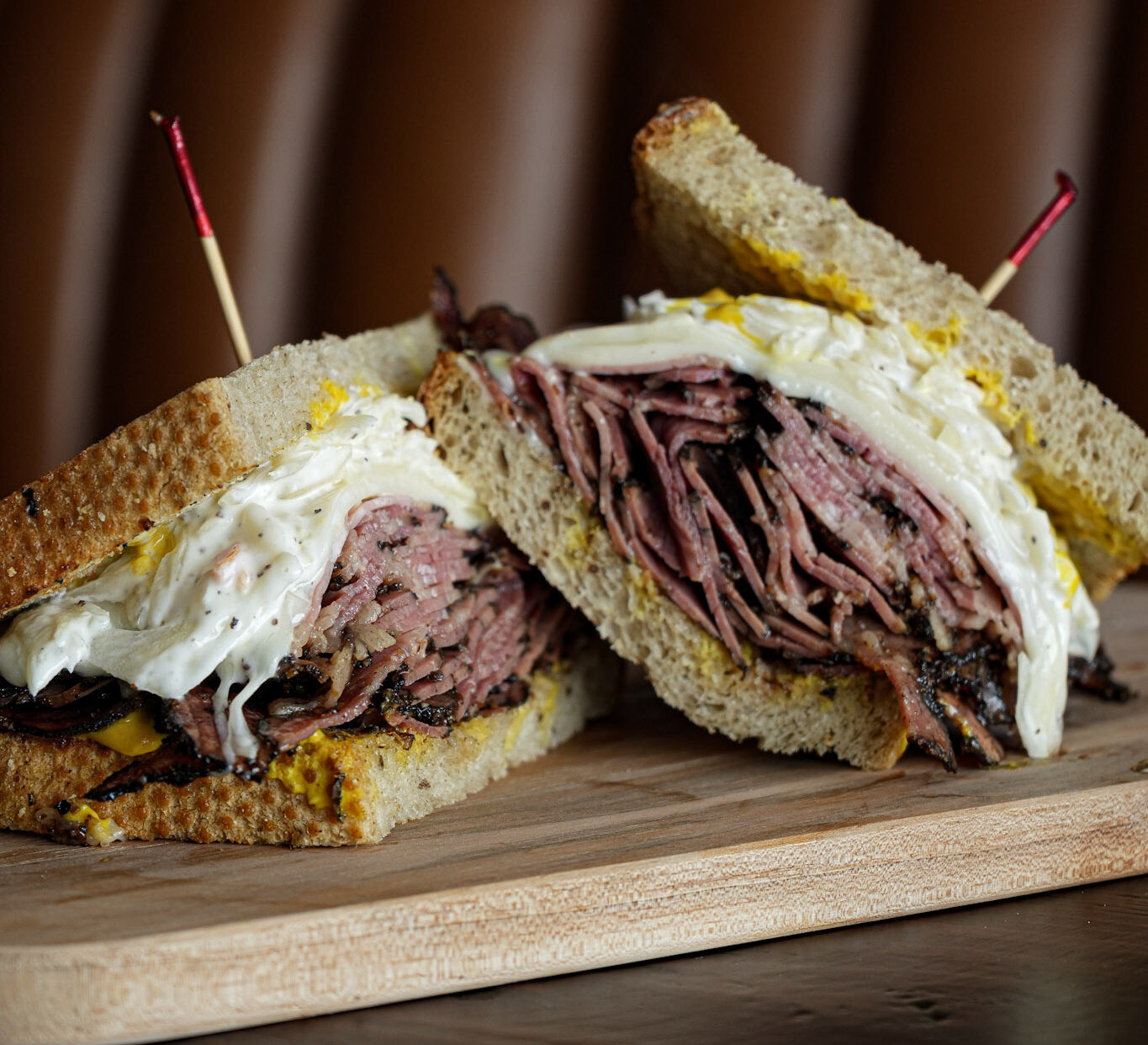The New York sandwich on toasted rye with pastrami brisket, melted Swiss, house slaw and mustard