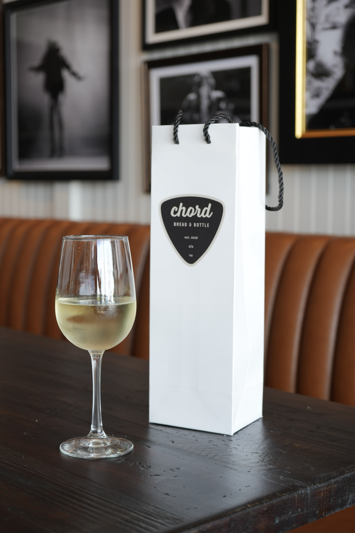 Chord Bread & Bottle branded takeaway bag on a table inside the Alexandria shop