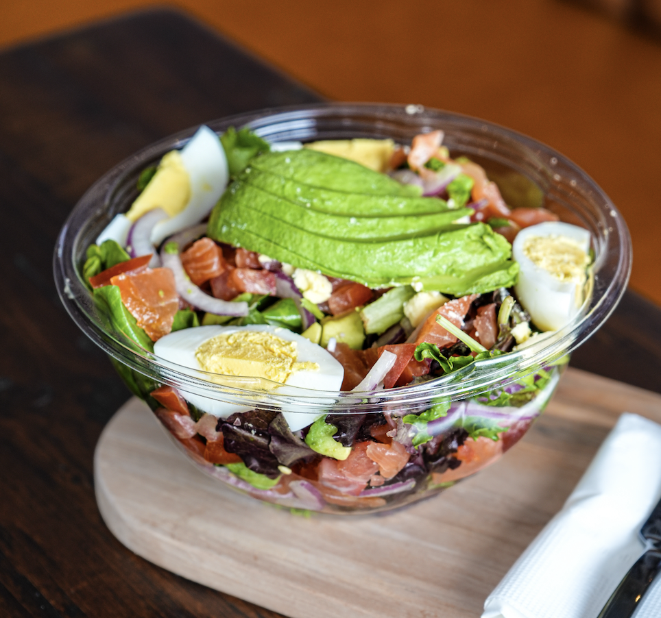 The Norweigan salad with mixed field greens, smoked salmon, boiled egg, avocado, red onion and tomato