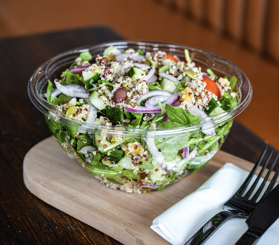 King & Quinoa salad with arugula, cucumber, cherry tomato, quinoa, red onion and green goddess dressing