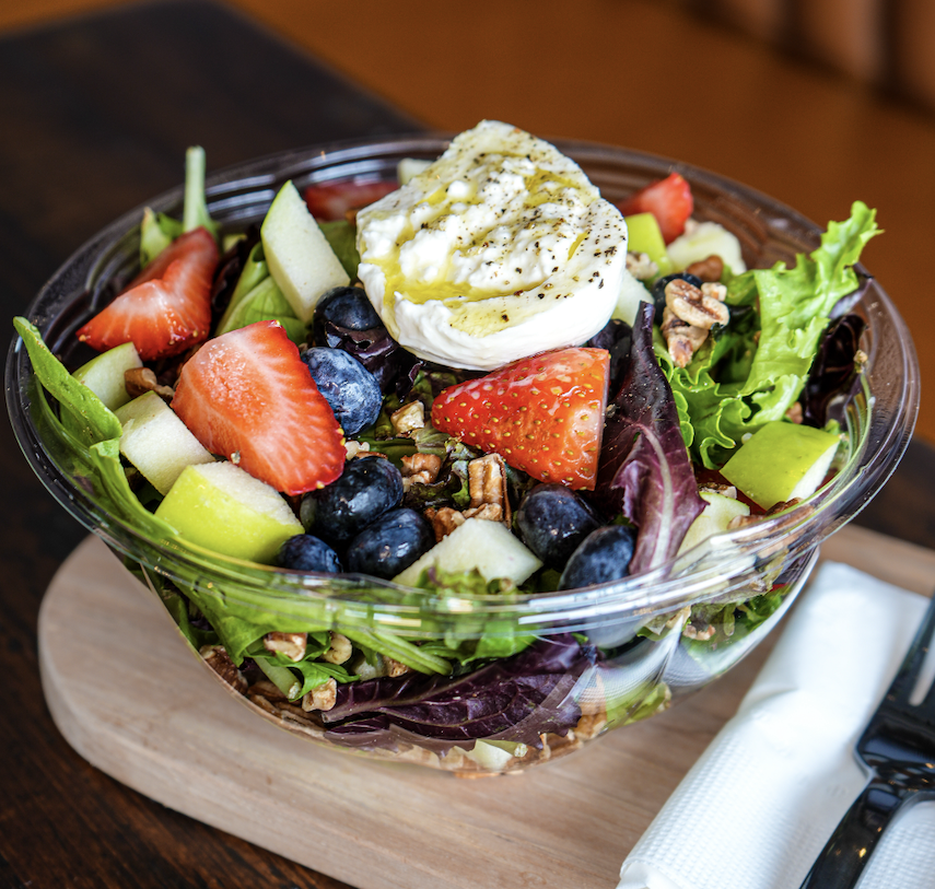 Burrata & Raspberry salad with mixed field greens, burrata cheese, apple, seasonal berries and pecans