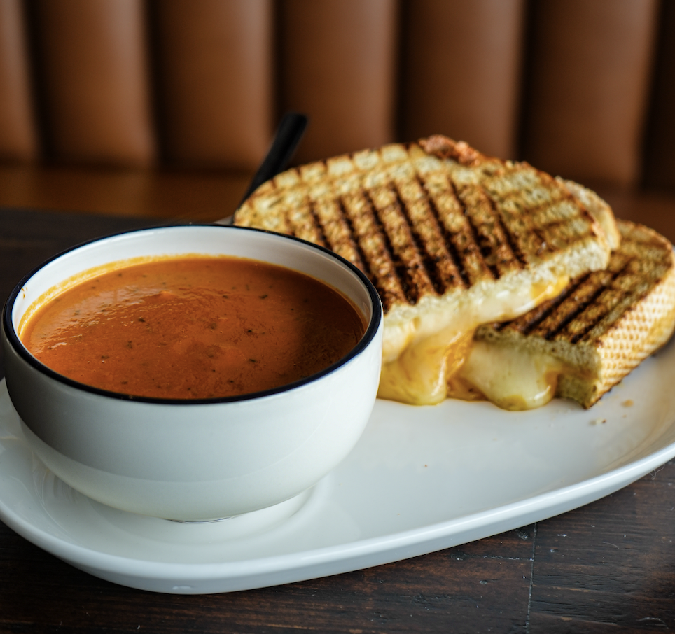 Tomato basil bisque served with a pressed grilled cheese at Chord Bread & Bottle