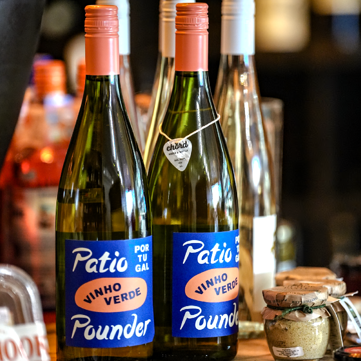 Bottles of approachable white wine on the shelf at Chord Bread & Bottle in Alexandria